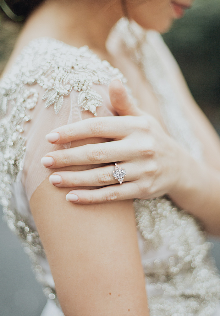 Editorial bridal image featuring a custom engagement ring