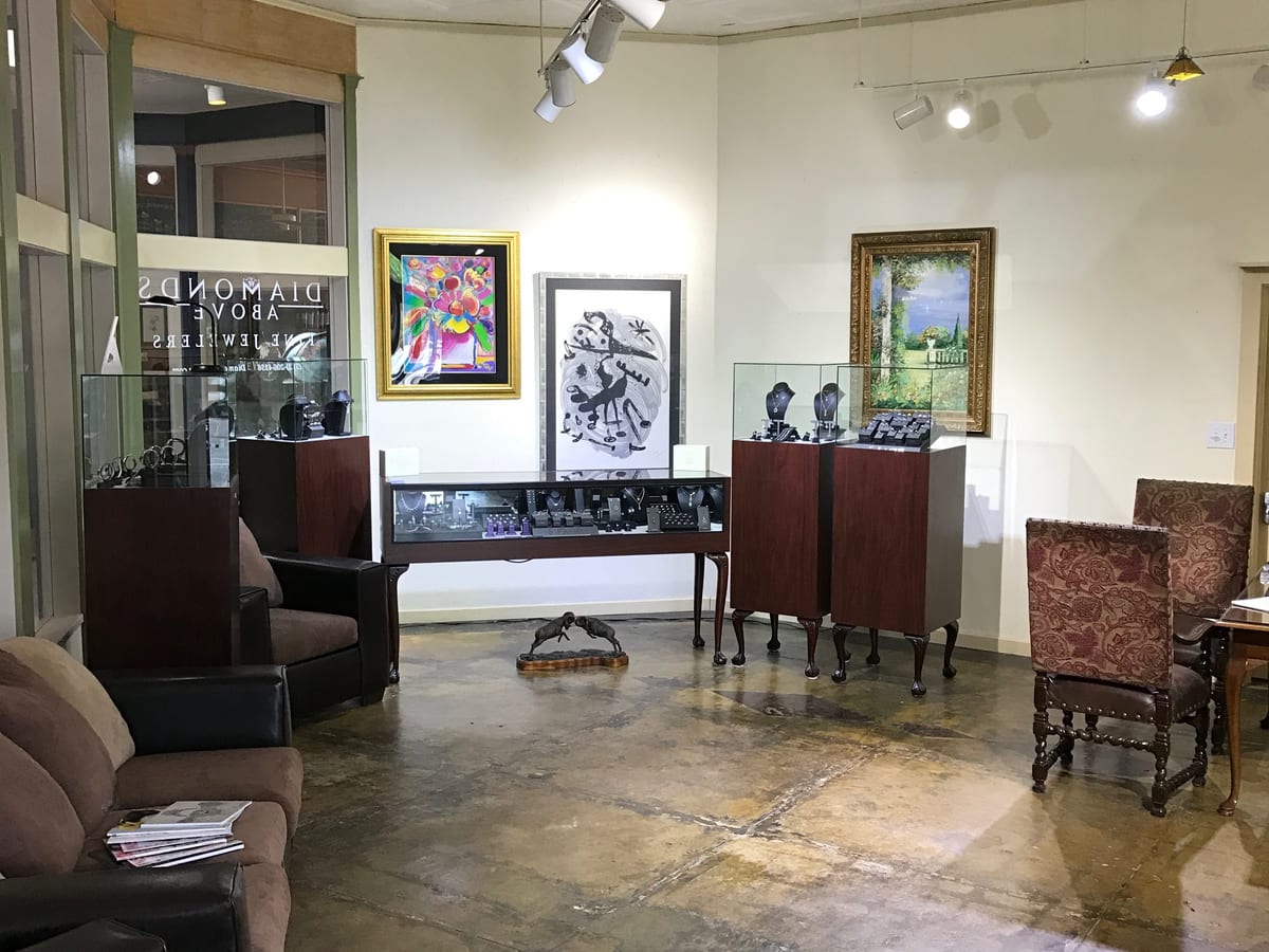 Interior of the Diamonds Above showroom in Austin, Texas with display cases and local artwork