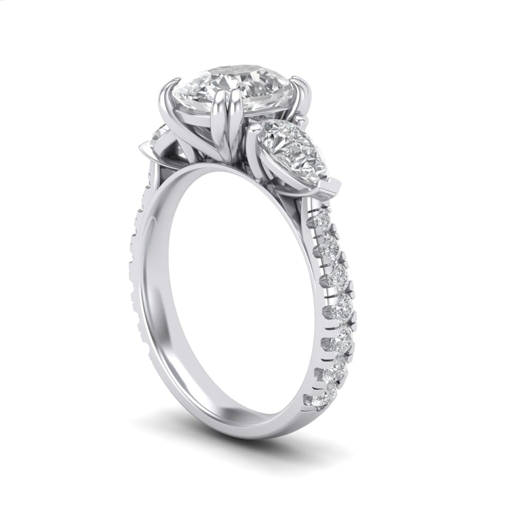 CAD render of oval diamond three-stone with pear-shape side stones set on a diamond pavé shank