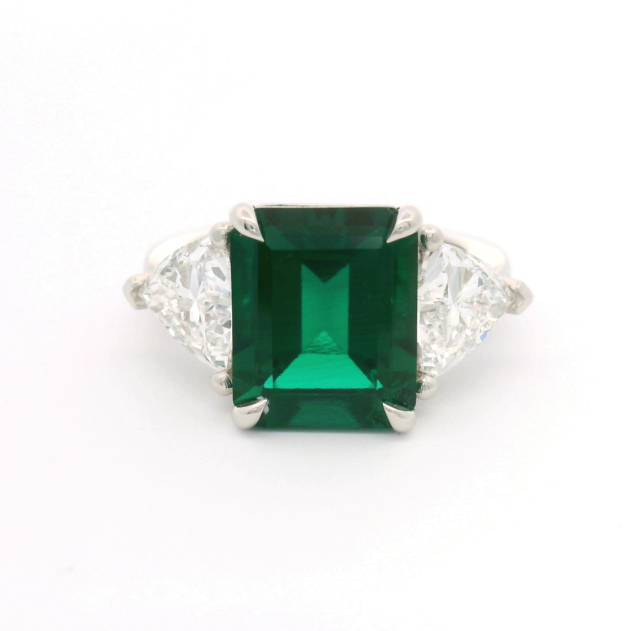 Custom colored gemstone ring with diamond accents